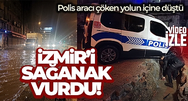 İzmir’i sağanak vurdu: Polis aracı çöken yolun içine düştü