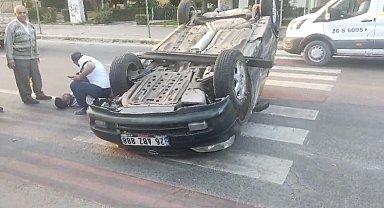 Takla atan araç içinde kalan sürücüyü çevredeki vatandaşlar kurtardı