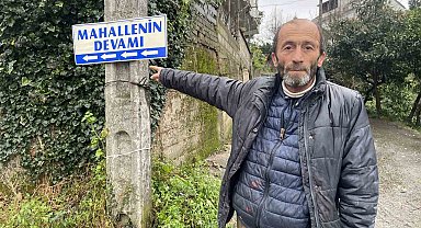 Mahallenin devamını tabelayla gösteriyor