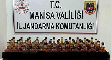 Manisa'da bir araç içerisinde 50 litre kaçak viski ele geçirildi