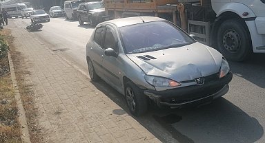 Otomobille çarpışan motosiklet sürücüsü yaralandı