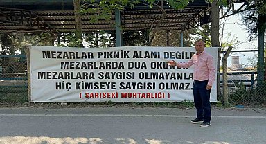 "Mezarlar piknik alanı değildir" diyen muhtar, mezarlıklarda pikniği yasakladı