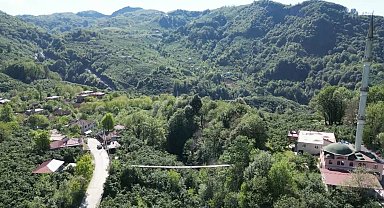 Mahallenin ihtiyaçları için inşa edilen asma köprü vatandaşların ilgi odağı oldu