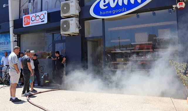 İşyerinin yanışını çaresiz bakışlarla izledi