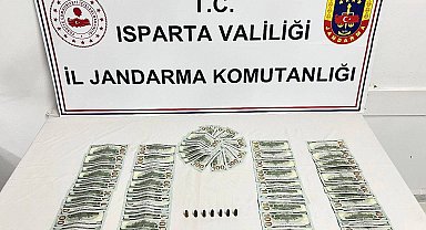 Isparta'da piyasaya sahte dolar sürmek üzere olan 3 şahıs yakalandı