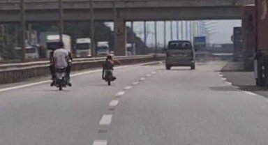 Otobanda motosikletin üzerine yatarak canını hiçe sayan çılgın sürücüye 10 bin TL ceza