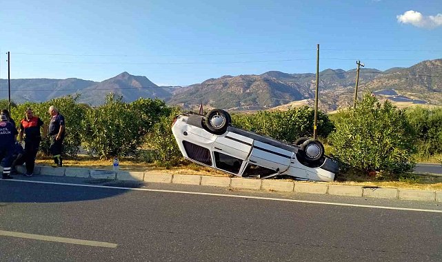 Takla atarak ters dönen otomobilden burunları kanamadan çıktılar