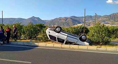 Takla atarak ters dönen otomobilden burunları kanamadan çıktılar