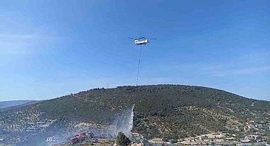 Foça'da bir depoda başlayan ve ormanlık alana sıçrayan yangın söndürüldü