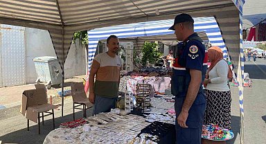 Jandarma sahte para konusunda esnafı bilgilendirdi