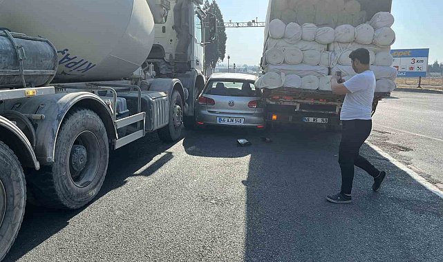 Otomobil, kamyon ve iş makinası arasında sıkıştı